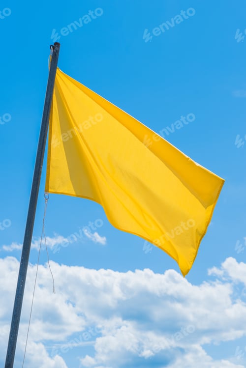 Preview: The Waving Green Flag Indicating The Potentially High Surf At The Beach