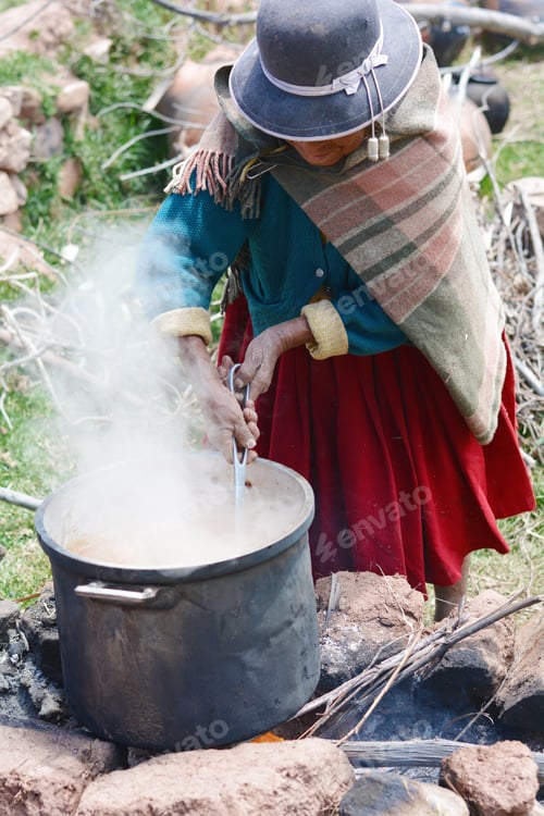 Preview: Old Native American Woman Cooking Outside.
