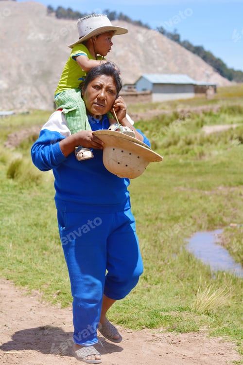 Preview: Native American Woman With His Little Son On Shoulders In The Countryside.