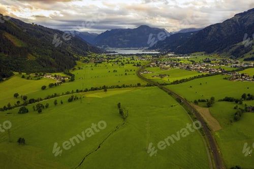 Preview: A High Angle Shot Of The Field Surrounded By Hills Captured On A Cloudy Day
