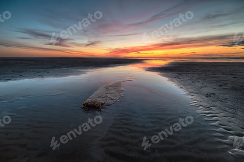 Preview: A Breathtaking Shot Of A Beautiful Beach On A Wonderful Sunset Background