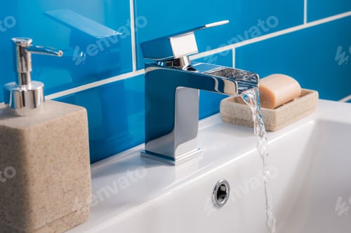 Preview: The New And Modern Steel Faucet With The Ceramic Sink In The Bathroom