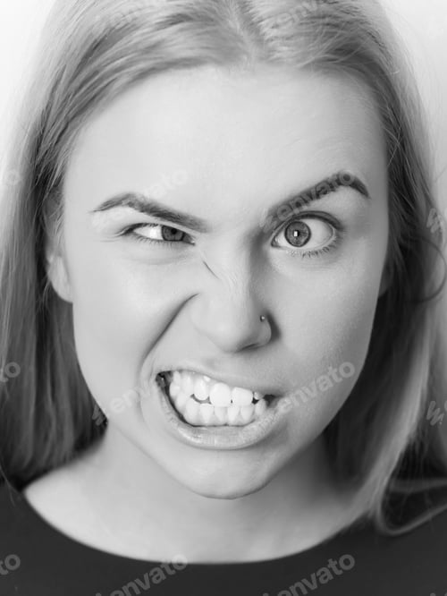 Preview: Girl Is Yelling At The Camera. Woman Squinting Eyes On Silly Face With Makeup Foundation. Funny