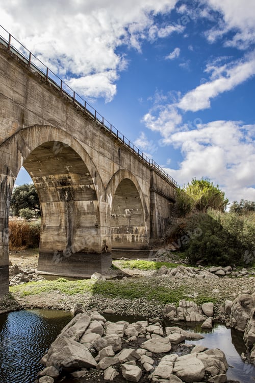 Preview: A Stone Bridge With Arches And A Cloudy Sky