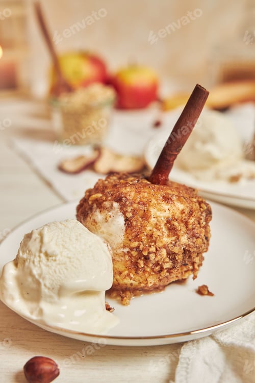 Preview: A Delicious Baked Apple With Nuts And Cinnamon For Christmas On A White Table