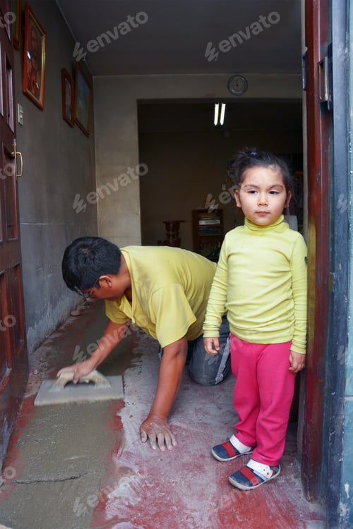 Preview: Latin Man With His Daughter Working With Cement