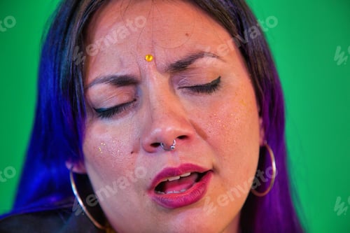 Preview: Latin Woman Singing With An Acoustic Guitar On Purple Background With Drained Blue And Light