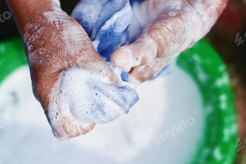 Preview: Old Person Washing Clothes With A Lot Of Foam.