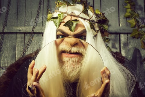 Preview: Zeus God Man Or Jupiter With Magnifying Glass And Vine Crown On Long Hair With Beard