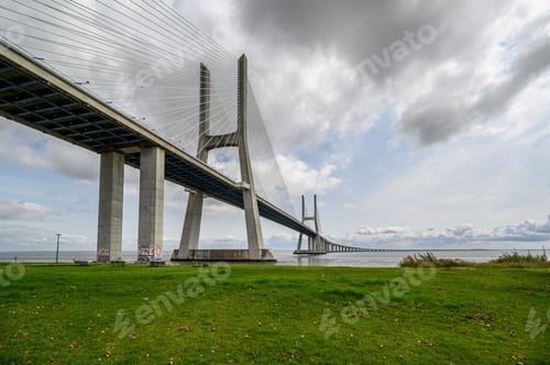 Preview: The Famous Vasco Da Gama Bridge In Sacavem, Portugal Under The Cloudy Sky
