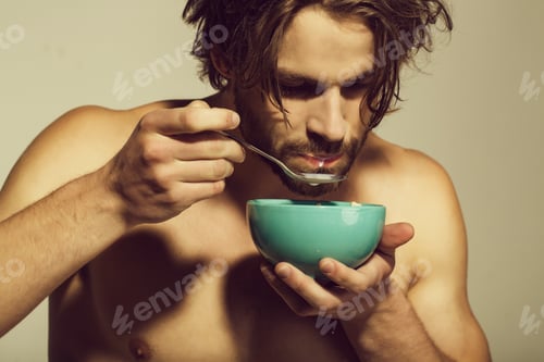 Preview: Healthy Food And Dieting, Fitness, Morning. Man With Bare Chest Eating Breakfast Of Oatmeal With
