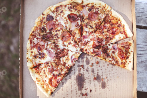 Preview: A Closeup Overhead Shot Of A Delicious Pizza In An Outdoor Environment