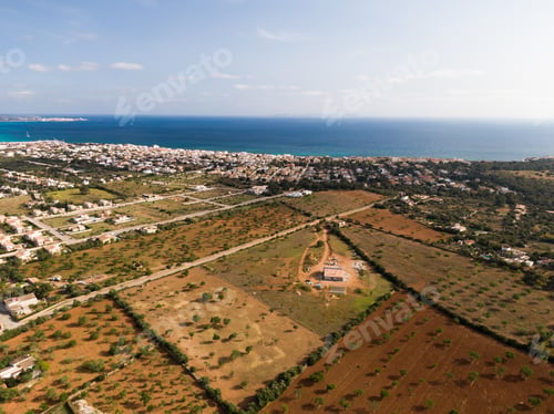 Preview: An Aerial Shot Of Beautiful Blue Sea And Buildings In Mallorca Balearic Islands In Spain With A