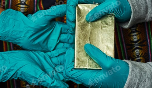 Preview: A Closeup Of People Exchanging Christmas Gifts While Wearing Medical Gloves - New Normal