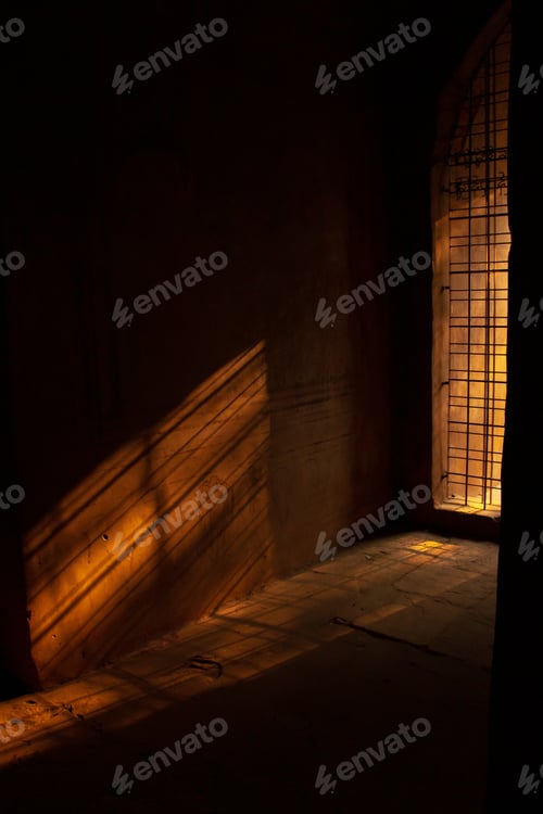Preview: A Vertical Shot Of Sunlight Shining Through A Wall Inside Of A Temple In Bagan, Myanmar