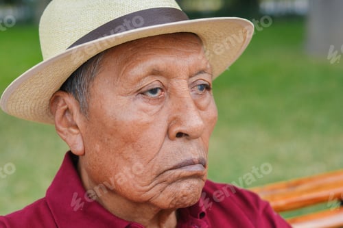 Preview: Sad Old Latin Man Wearing Hat In The Summer Park.