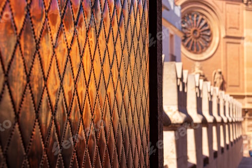 Preview: A Window With Diagonal-Shaped Patters And Stone Statues On The Top Of The Cathedral
