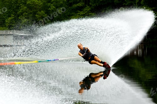 Preview: An Active Senior Male Water Skiing In A Small Water Passage