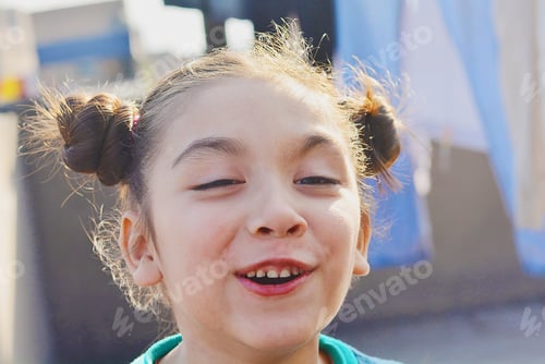 Preview: Little Latin Girl Laughing Outside.