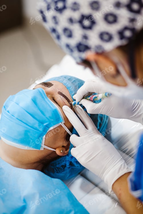 Preview: Latin Cosmetologist Preparing To Mexican Woman For Eyebrow Permanent Makeup Procedure In Mexico