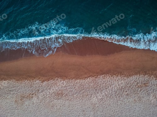 Preview: A Top View Of Waves On The Sandy Beach On Crete Island