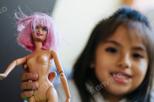 Preview: Cute Little Girl Playing With Toy Doll
