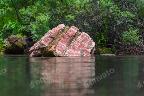 Preview: A Big Red Rock And Its Reflection On The Lake - Background Concept