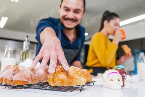 Preview: Mexican Man Baking Bread Called Pan De Muerto Traditional From Mexico In Halloween