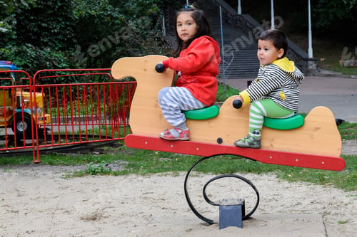 Preview: Little Latin Siblings On The Playground.