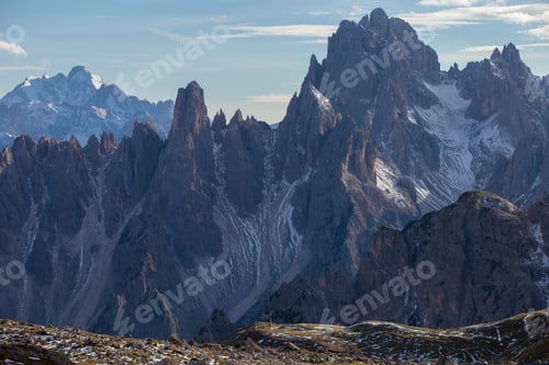 Preview: A Breathtaking Shot Of Snowy Rocks In The Italian Alps Under The Bright Sky