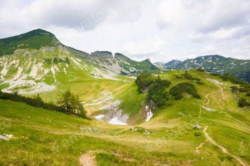 Preview: A Beautiful Shot Of Austrian Hills Under The Cloudy Sky