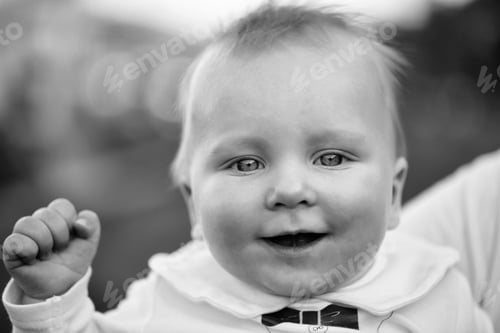 Preview: Happy Todler. Baby Boy Smiling On Sunny Summer Day Outdoors In White Shirt On Natural Background
