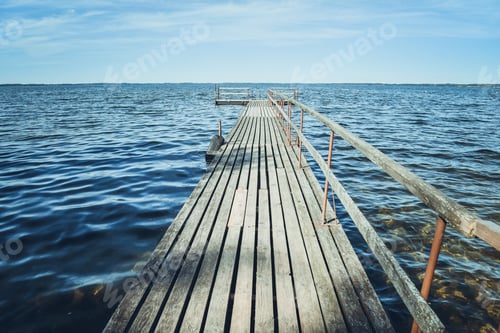 Preview: A Wooden Pier In A Wavy Lake