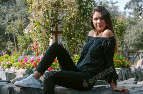 Preview: Sport Fashion Girl Sitting On Rock In The Green Park