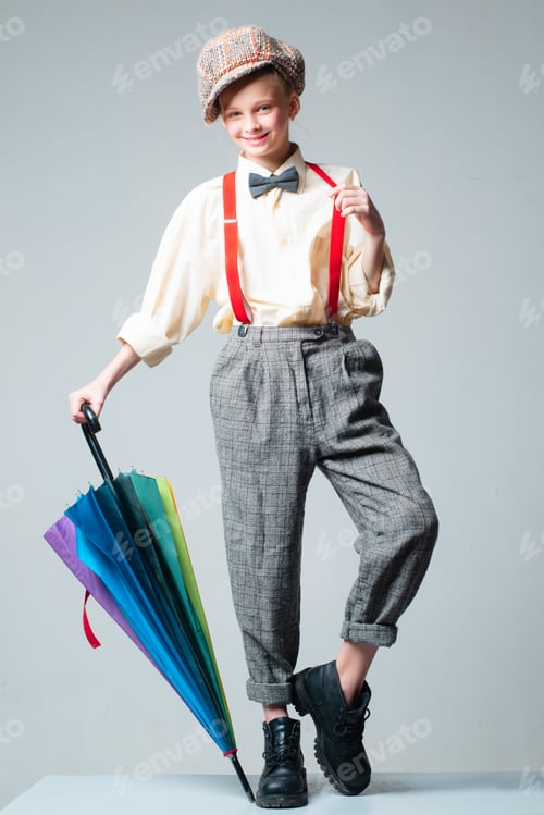 Preview: Autumn. Vintage English Style. Teen Girl In Retro Suit With Umbrella. Suspender And Bow Tie. Old
