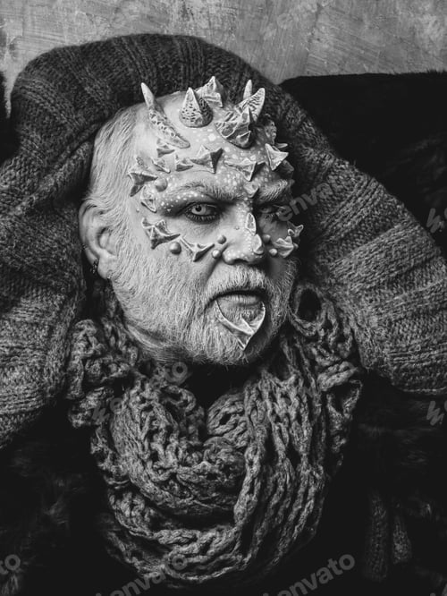 Preview: Man With Dragon Skin And Beard. Monster Face With White Eyes, Sharp Thorns And Warts. Demon Head