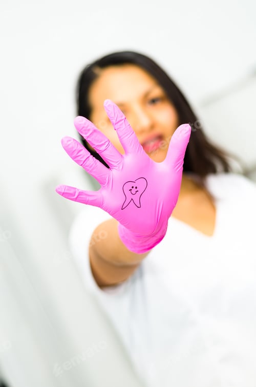 Vista previa: Dentist Woman Showing Her Hand With A Tooth Drawing, Dental Concept