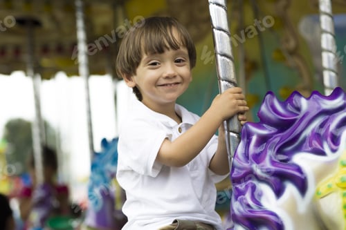 Preview: Happy Boy Having Fun Riding On Carnival Carousel