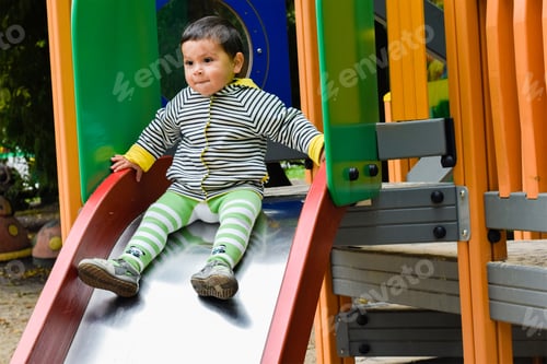Preview: Serious Little Latin Boy On The Playground.
