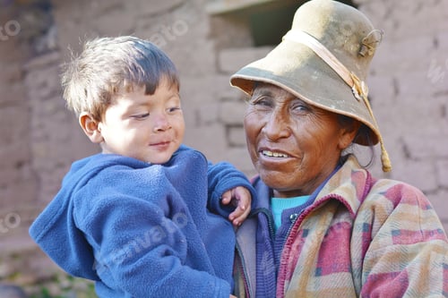 Preview: Native American Old Woman Holding Her Little Grandson. Happy Interracial Family.