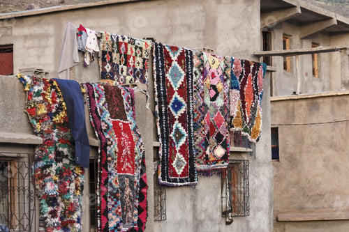 Preview: The Colorful Carpets Drying While Hanging On The Wall