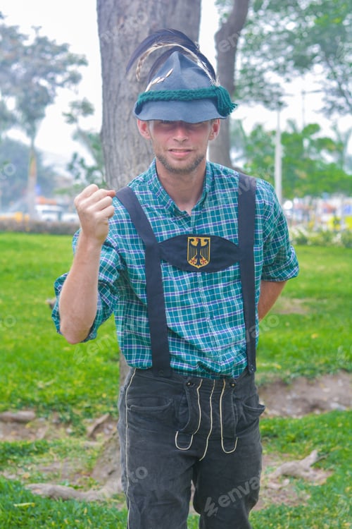 Preview: Young Caucasian Man Wearing Traditional German Clothes With German Coat Of Arms On The Chest