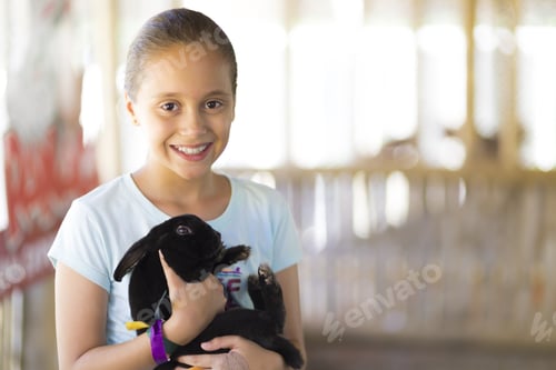 Preview: Happy Girl Playing With Rabbit In The Farm