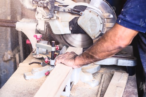 Preview: Man Cutting Wood with a Circular Saw