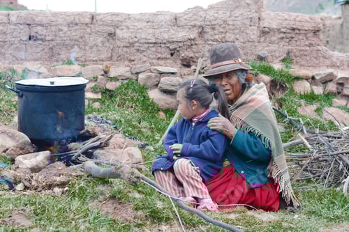 Preview: Native American Grandmother And Her Little Granddaughter Cooking In The Countryside.