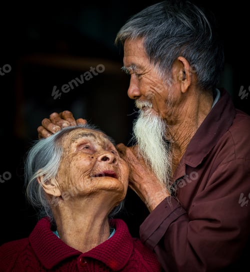 Preview: Hoi An, Vietnam - Mar 14, 2018: An Asian Couple With An Old Lady Looking Up At Her Husband While