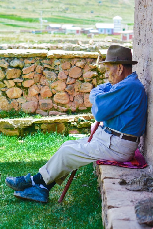 Preview: Serious Native American Old Man With Walking Stick In The Countryside.