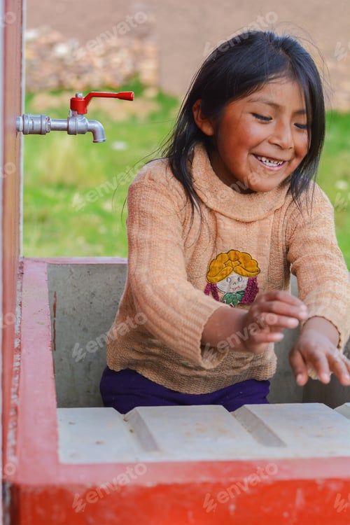 Preview: Happy Native American Little Girl Sitting In The Washbasin.