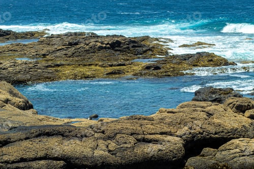 Preview: A Mesmerizing View Of A Beautiful Seascape And Rocks At Daytime