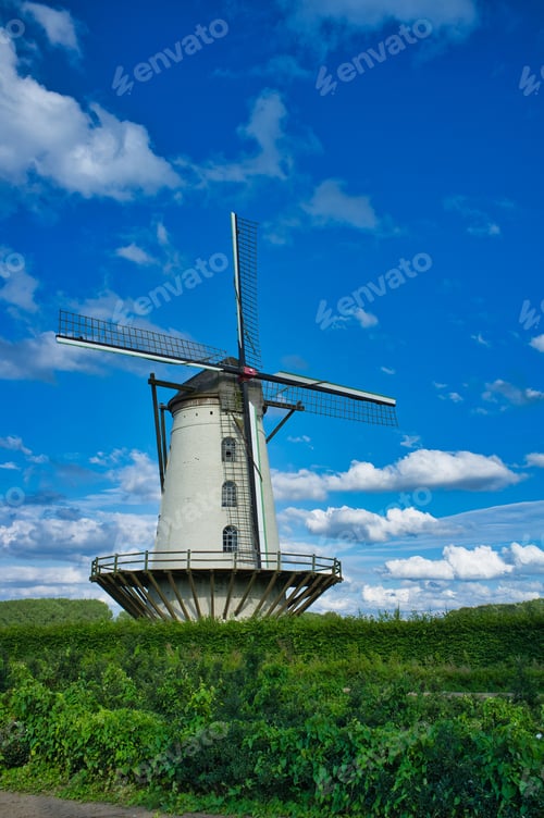 Preview: A Vertical Shot Of The Fauconniersmolen Windmill In Ghent, Belgium